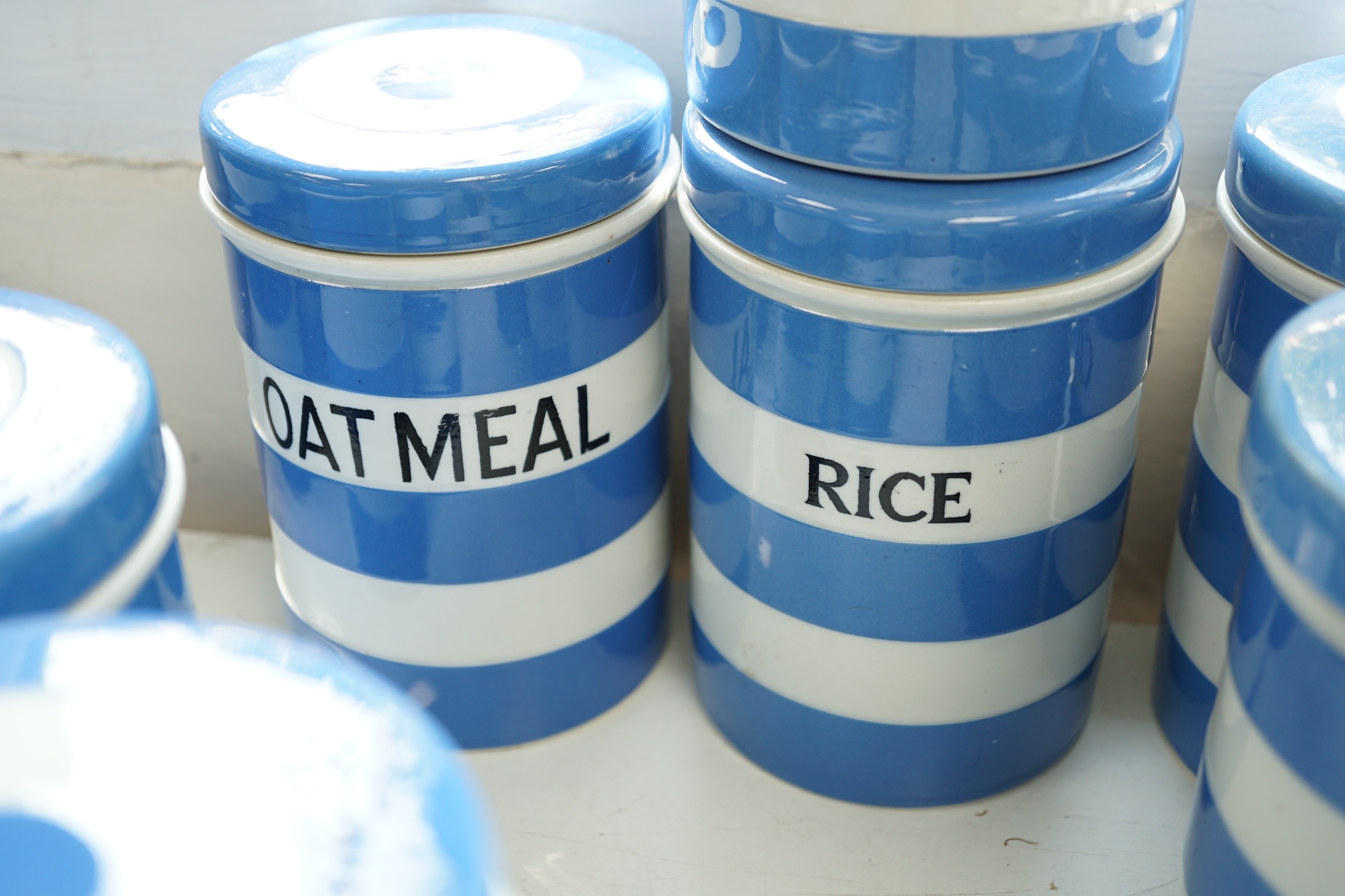 T.G.Green Cornish Kitchenware, ten 14cm lidded storage jars to include Green-Peas, Split- Peas, Cornflour, Ground Rice and Barley, mainly Black Shield marks. Condition - poor, fair and good